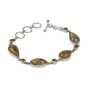 An Elegant Design with 4 Beautiful Goldan Rutiles Set in a Sterling Silver Bracelet and Accented with Small Round Faceted Peridot and Citrine Gems Gems