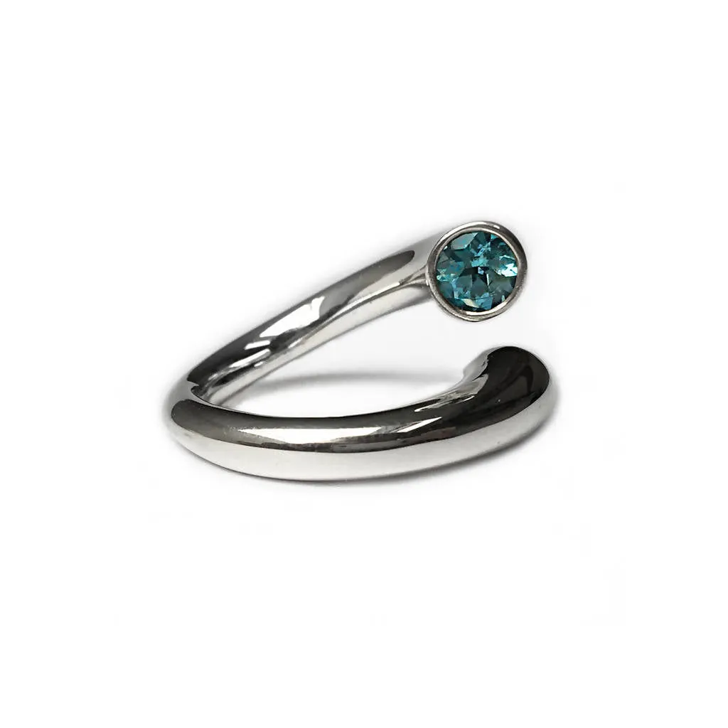 Double taper silver wiggly ring with blue topaz