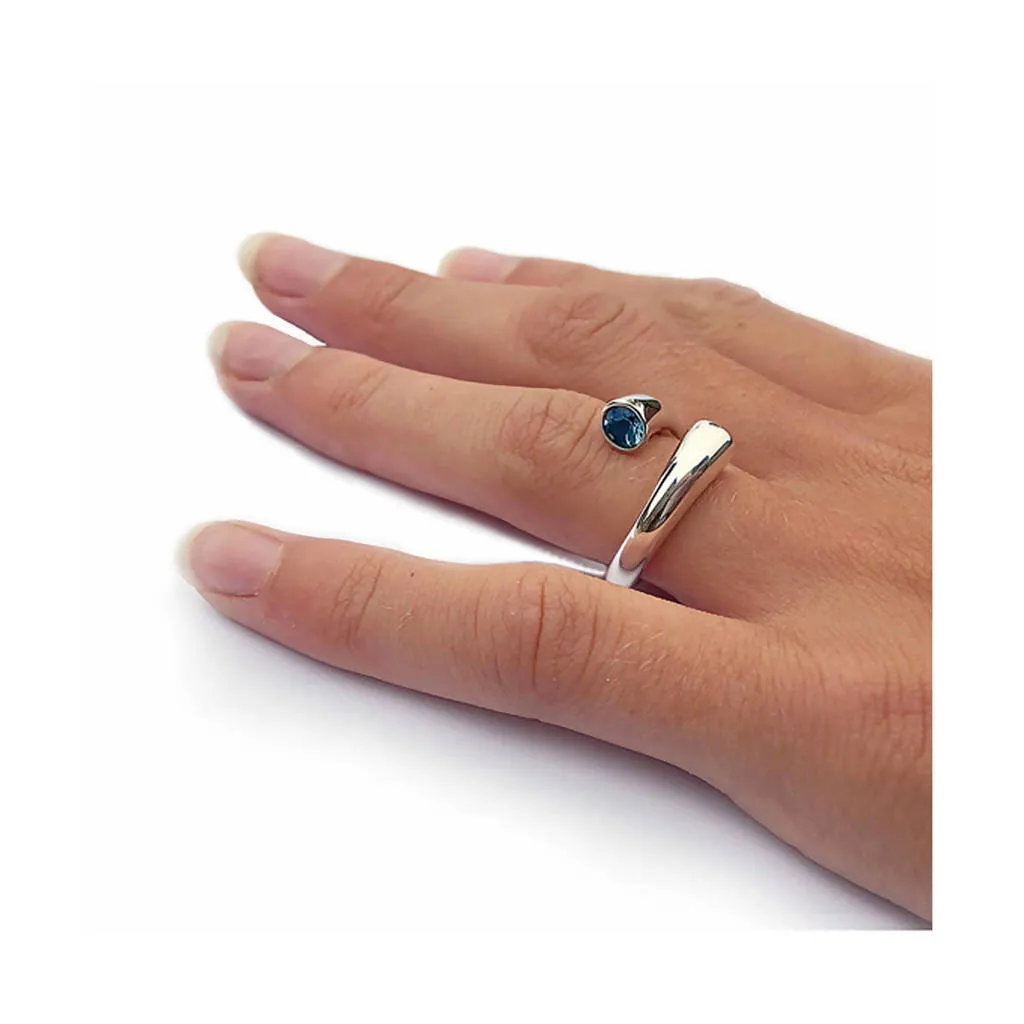 Double taper silver wiggly ring with blue topaz