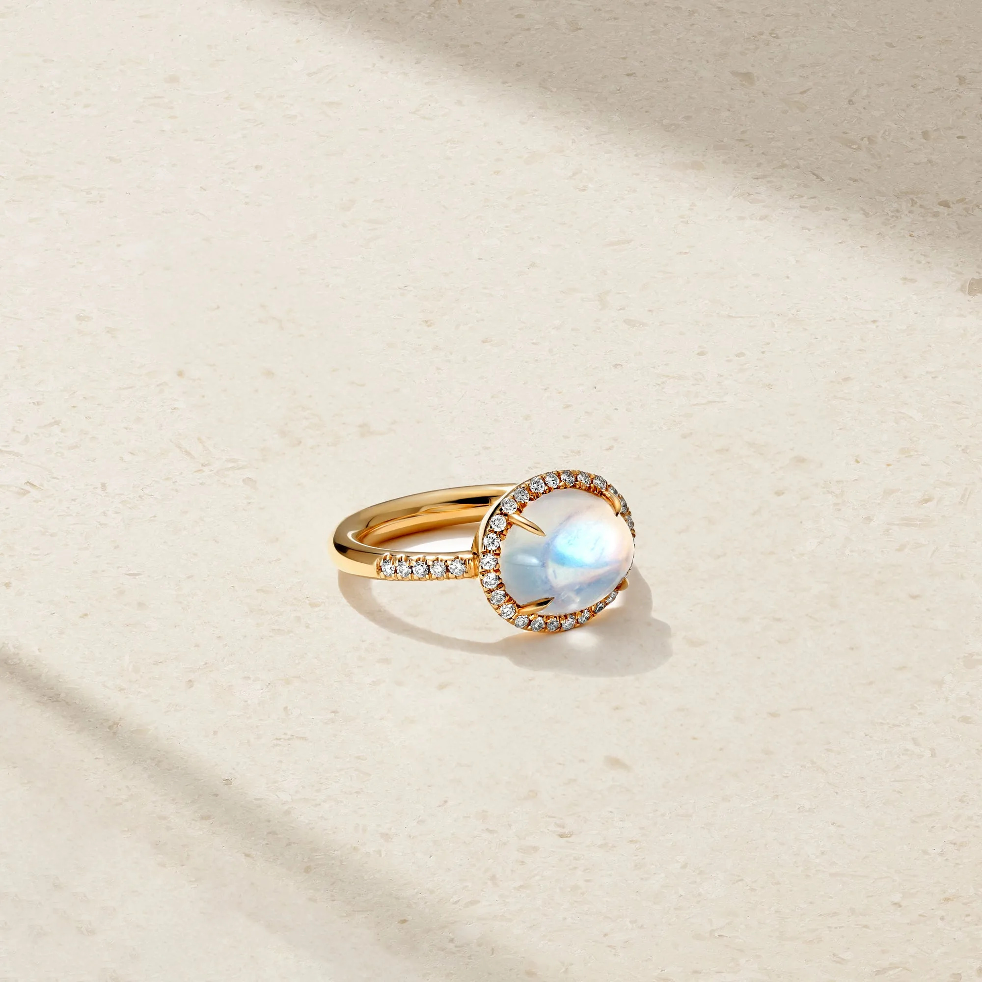 East-West Moonstone and Diamond Halo Ring